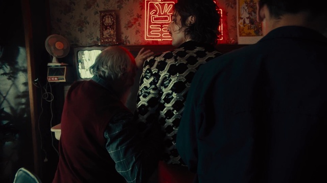 Video Reference: Sleeve, T-shirt, Event, Fun, Darkness, Font, Visual arts, Room, Recreation, Art