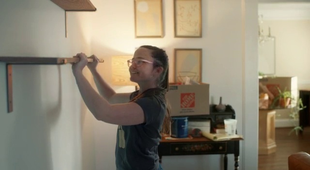 Video Reference: Glasses, Standing, Gesture, Wood, Picture frame, T-shirt, Elbow, Smile, Room, Event