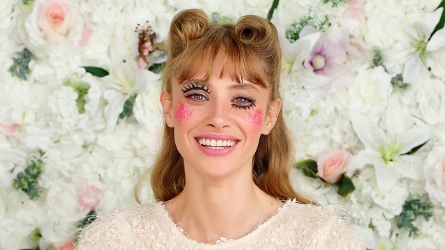 Video Reference: Face, Smile, Flower, Plant, Facial expression, White, Petal, Happy, Eyelash, Sunglasses