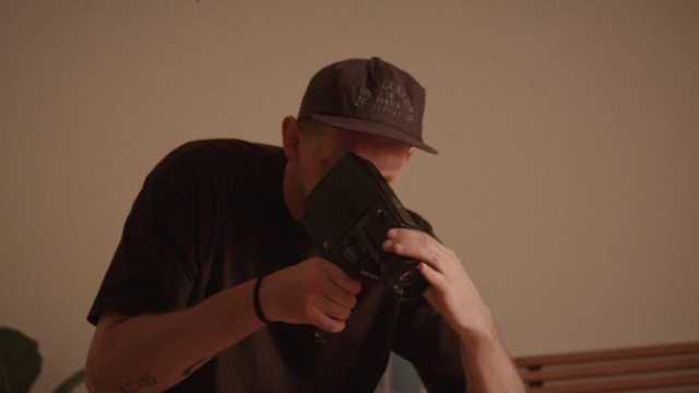 Video Reference: Clothing, Hand, Arm, Shirt, Cricket cap, Cap, Sleeve, Baseball cap, Gesture, T-shirt