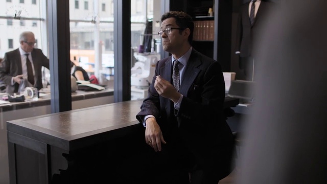 Video Reference: Suit trousers, Coat, Dress shirt, Gesture, Tie, Automotive design, Eyewear, Suit, Blazer, White-collar worker