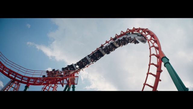 Video Reference: Sky, Cloud, Roller coaster, Pole, Leisure, Recreation, Event, Composite material, Amusement ride, Fun