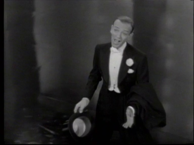 Video Reference: Suit trousers, Gesture, Flash photography, Collar, Suit, Tie, Blazer, Formal wear, Sleeve, Event