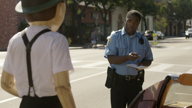 Video Reference: Shirt, Hat, Sun hat, Fedora, Gesture, Yellow, Security, Motor vehicle, Cap, T-shirt