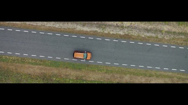 Video Reference: Automotive lighting, Asphalt, Road surface, Automotive mirror, Automotive exterior, Rectangle, Tar, Rolling, Grass, Tints and shades