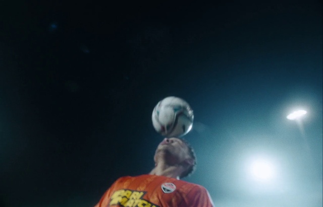 Video Reference: Ball, Football, Performing arts, Entertainment, Player, Astronomical object, Event, Sports equipment, T-shirt, Sky