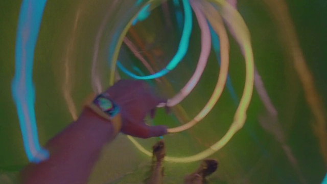 Video Reference: Hand, Plant, Gesture, Terrestrial plant, Electric blue, Art, Magenta, Circle, Grass, Pattern