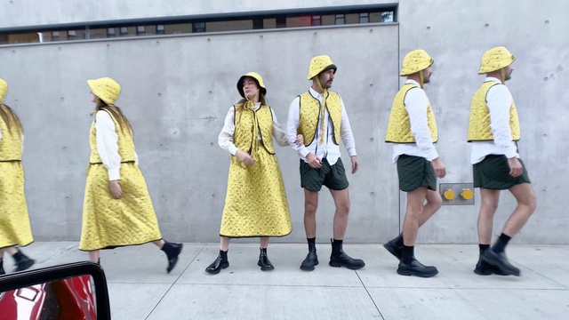 Video Reference: Footwear, Shoe, Shorts, Street fashion, Fashion, Standing, Yellow, Headgear, Hat, Fashion design