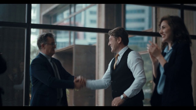 Video Reference: Clothing, Arm, Coat, Sleeve, Gesture, Suit, Blazer, White-collar worker, Formal wear, Flash photography