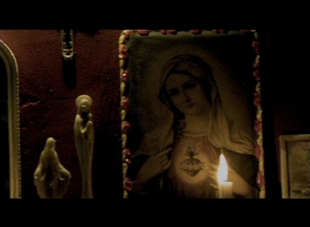 Video Reference: Candle, Art, Wood, Sculpture, Tints and shades, Artifact, Religious item, Darkness, Visual arts, Rectangle