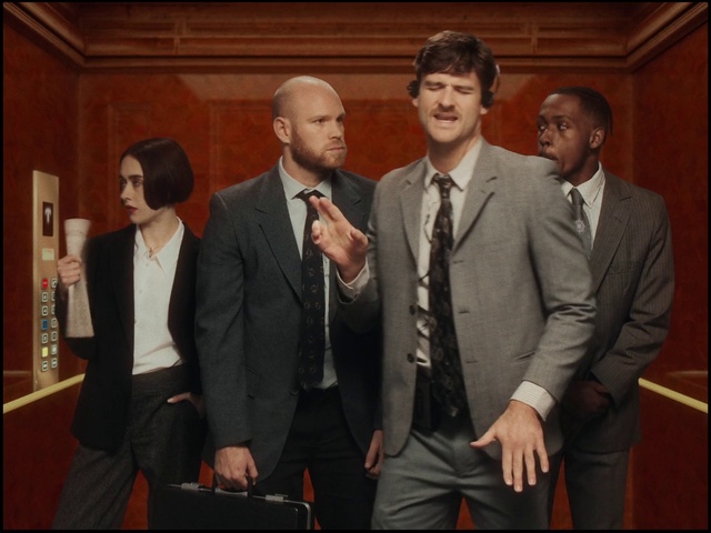 Video Reference: Suit trousers, Trousers, Tie, Coat, Gesture, Suit, Dress shirt, Blazer, Formal wear, Event