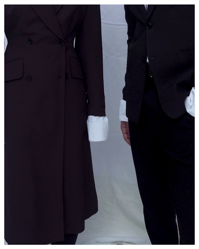 Video Reference: Neck, Sleeve, Street fashion, Overcoat, Collar, Grey, Waist, One-piece garment, Fashion design, Blazer