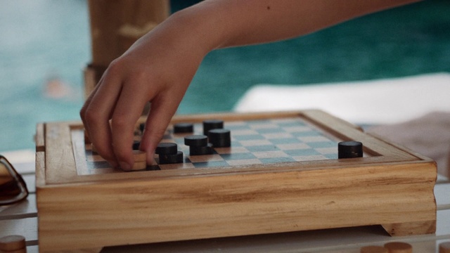 Video Reference: Hand, Wood, Gesture, Thumb, Table, Indoor games and sports, Wood stain, Flooring, Wrist, Hardwood