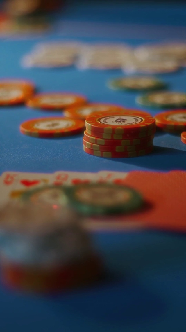 Video Reference: Blue, Orange, Poker, Poker table, Font, Indoor games and sports, Electric blue, Circle, Recreation, Gambling