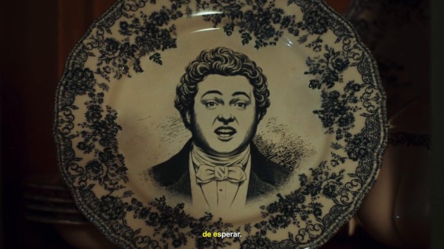 Video Reference: decorative plate, portrait, illustration, ceramic, vintage style, close-up, interior, subtitles, ornate pattern, black and white, handheld, still life
