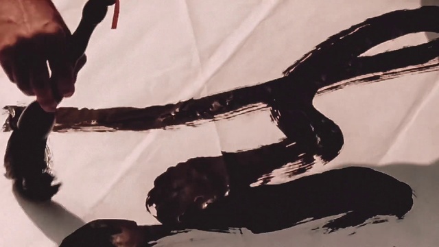 Video Reference: Black, Gesture, Style, Wood, Finger, Art, Tints and shades, Font, Tree, Human leg