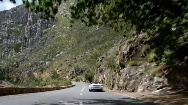 Video Reference: Land vehicle, Plant, Vehicle, Car, Infrastructure, Mountain, Road surface, Asphalt, Slope, Highland