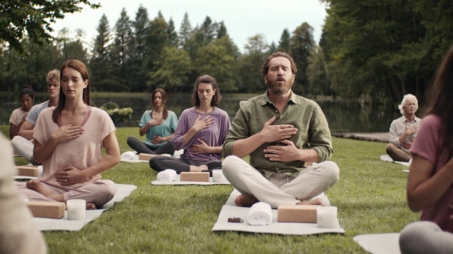 Video Reference: Face, Shorts, Leg, Water, Sky, Yoga mat, Tree, Outdoor recreation, Leisure, Social group