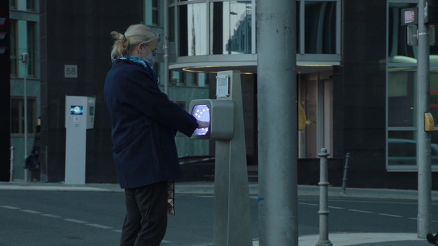 Video Reference: Window, Hat, City, Gas, Metropolitan area, Building, Street fashion, Urban area, Human settlement, Pedestrian