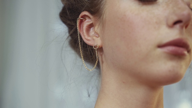 Video Reference: Nose, Skin, Lip, Eyelash, Earrings, Neck, Ear, Jaw, Body jewelry, Body piercing