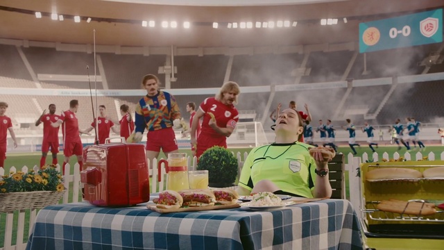 Video Reference: Table, Human body, Tablecloth, Community, T-shirt, Chair, Event, Competition event, Leisure, Hat