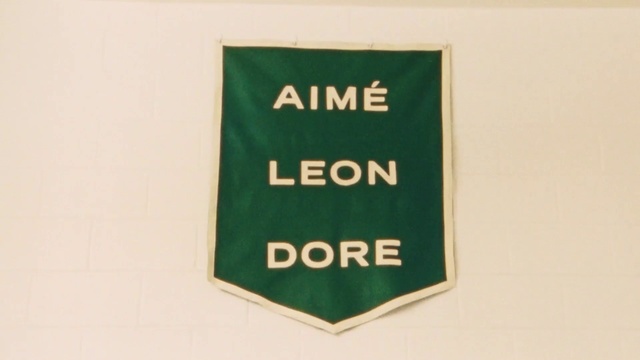 Video Reference: Rectangle, Font, Signage, Brand, Sign, Symbol, Graphics, Event, Label, Logo