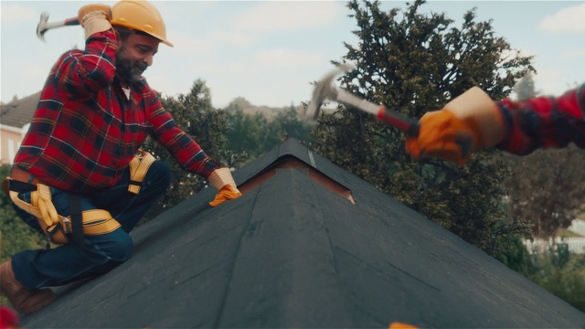 Video Reference: Sky, Hard hat, Helmet, Asphalt, Gesture, Tree, Workwear, Road surface, Roofer, Tartan