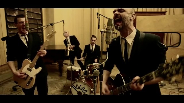 Video Reference: Clothing, Microphone, Band plays, Musical instrument, Drum, Guitar, Musician, String instrument, Membranophone, Guitarist