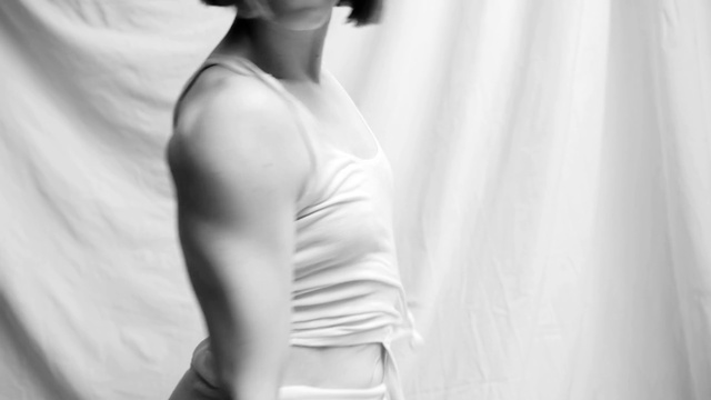 Video Reference: Joint, Shoulder, Neck, Flash photography, Dress, Sleeve, Standing, Gesture, Waist, Elbow