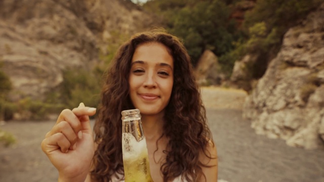 Video Reference: Hair, Hairstyle, Smile, Facial expression, People in nature, Nature, Flash photography, Happy, Body of water, Mammal