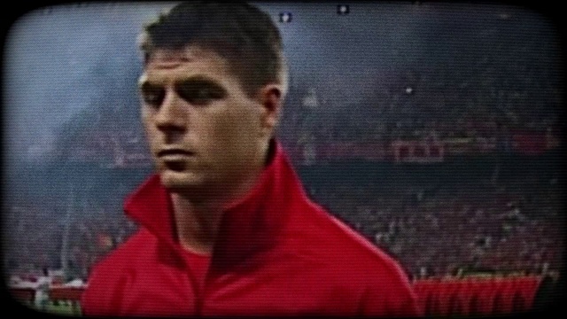 Video Reference: Jaw, Sports uniform, Player, Rectangle, Soccer, Display device, Net, Font, T-shirt, Soccer player