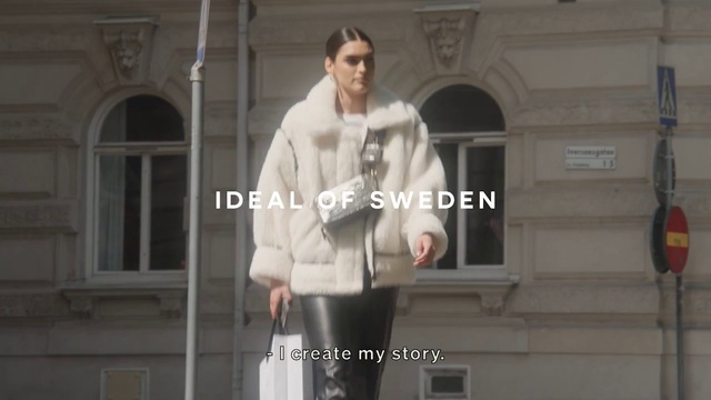 Video Reference: Neck, Sleeve, Window, Street fashion, Waist, Overcoat, Thigh, Knee, Blazer, Font