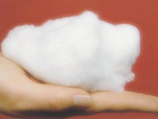 Video Reference: hand, cotton, fluffy, white, close-up, texture, material, soft, product, macro, background, red, object, holding