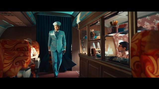 Video Reference: Head, Art, Fashion design, Space, Formal wear, Electric blue, Event, Fun, Suit, Room