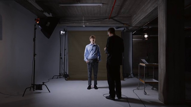 Video Reference: Flash photography, Chair, Audio equipment, Event, Technology, Darkness, Film studio, Flooring, Visual arts, Room