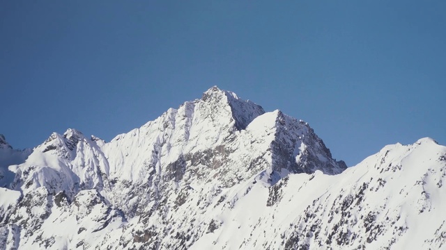 Video Reference: Sky, Mountain, Snow, Ice cap, Slope, Terrain, Mountain range, Nunatak, Natural landscape, Landscape