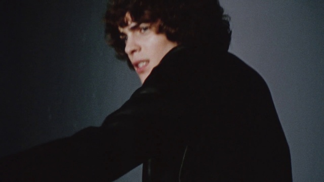 Video Reference: Cheek, Flash photography, Jaw, Neck, Sleeve, Gesture, Black hair, Blazer, Darkness, Event