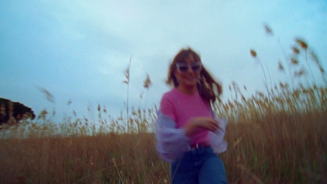 Video Reference: Sky, Plant, People in nature, Happy, Gesture, Sunglasses, Grass, Natural landscape, Grassland, Landscape