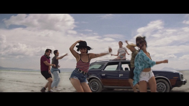 Video Reference: Tire, Wheel, Cloud, Sky, Shorts, Car, Vehicle, Flash photography, People on beach, Motor vehicle