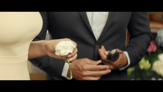 Video Reference: Hand, Flash photography, Bridal clothing, Gesture, Dress, Thumb, Finger, Happy, Wrist, Wedding ceremony supply