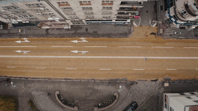 Video Reference: Infrastructure, Wood, Automotive tire, Architecture, Building, Motor vehicle, Asphalt, Road surface, Wall, Brickwork