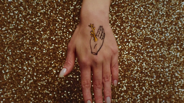 Video Reference: Body jewelry, Cosmetics, Gesture, Nail, Finger, Thumb, Nail care, Wrist, Font, Glitter
