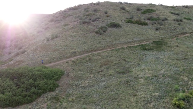 Video Reference: Mountain, Slope, Plant, Natural landscape, Terrain, Sky, Grassland, Grass, Landscape, Groundcover