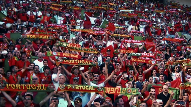 Video Reference: Product, Fan, Red, Crowd, T-shirt, Gesture, Event, Sports jersey, Celebrating, Stadium