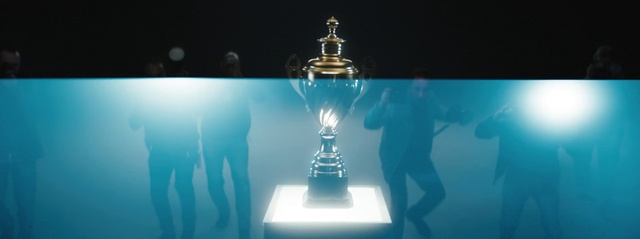 Video Reference: Photograph, Lighting, Automotive lighting, Table, Font, Trophy, Gas, Electric blue, Event, Art