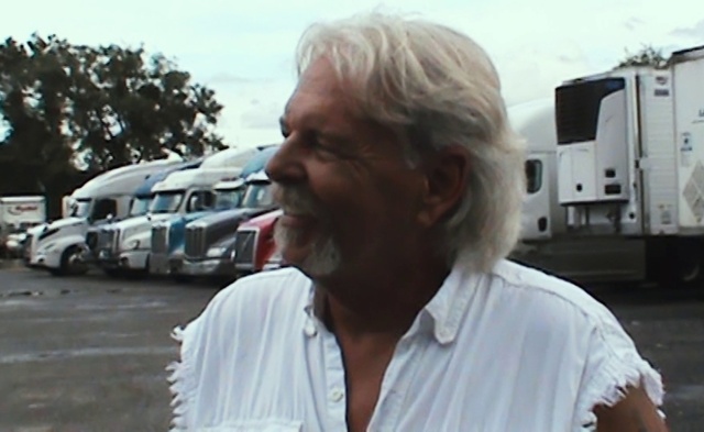 Video Reference: Vehicle, Motor vehicle, Sky, Beard, Automotive exterior, Travel, Facial hair, Cloud, Asphalt, Eyewear