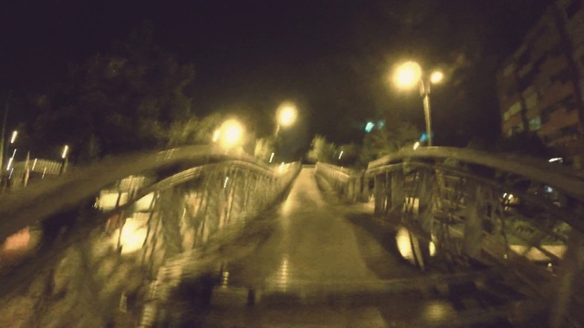 Video Reference: Automotive lighting, Street light, Road surface, Mode of transport, Asphalt, Headlamp, Thoroughfare, Road, Tints and shades, Sky