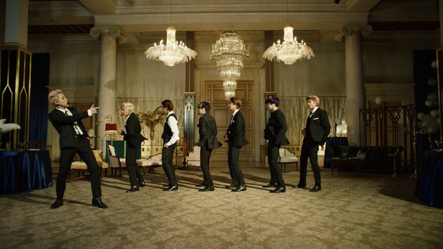 Video Reference: Trousers, Suit, Chair, Formal wear, Event, Official, Fashion design, Chandelier, Entertainment, Function hall