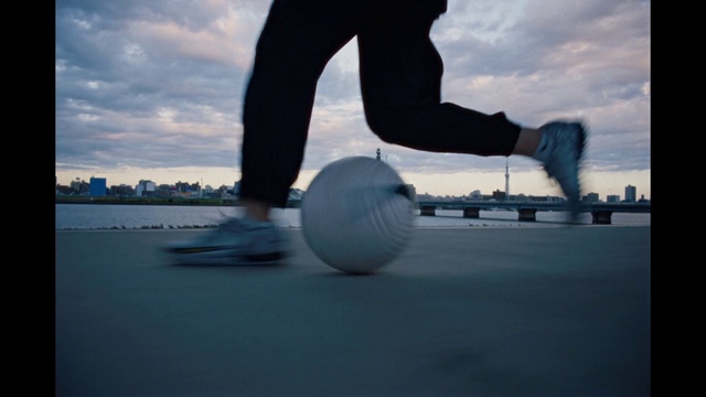 Video Reference: Cloud, Sky, Atmosphere, Sports equipment, Leg, Ball, Nature, Flash photography, Art, Rolling