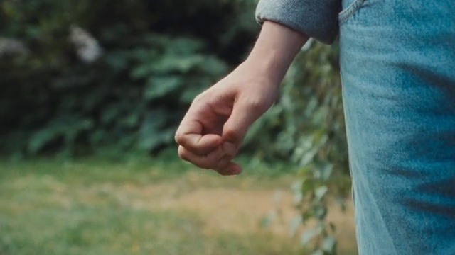 Video Reference: Sleeve, Gesture, Finger, Plant, People in nature, Thumb, Wrist, Happy, Grass, Human leg